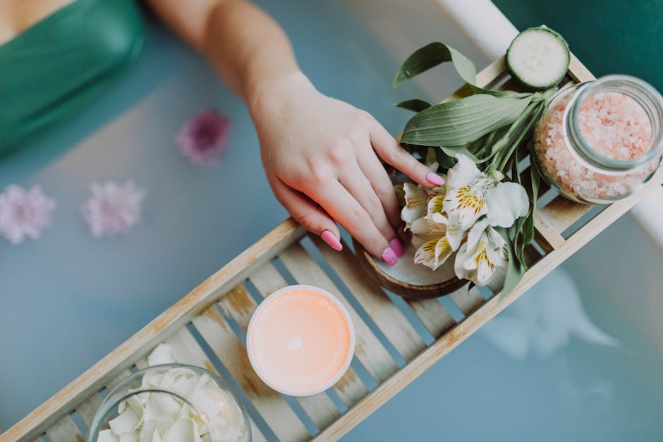 Elegant spa setting with flowers, bath salts, and calming ambiance for ultimate relaxation