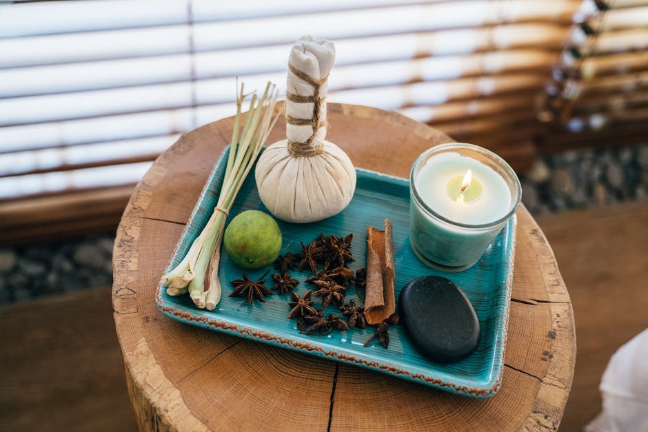 Beautiful spa setting featuring aromatherapy items on a wooden table for relaxation
