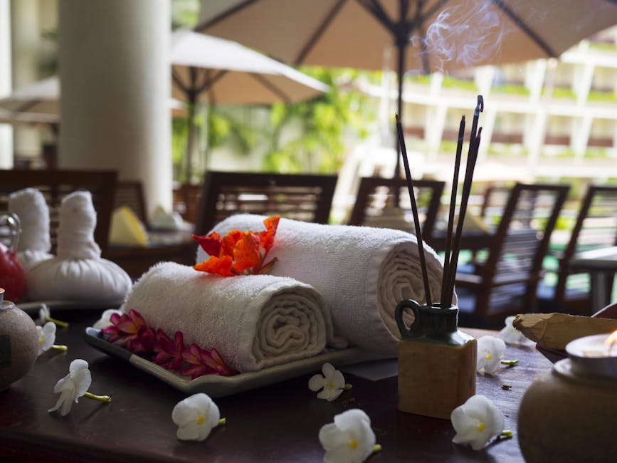 Relaxing spa scene with towels, incense, and flowers, perfect for wellness themes